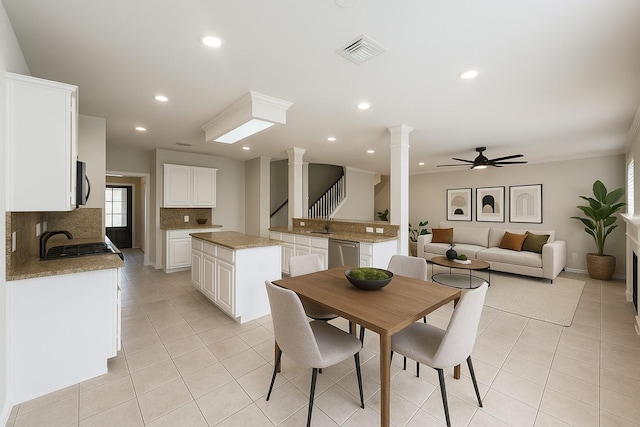 22 Crestview Trl, Houston, TX 77082 - dining area featuring ornate columns, light tile patterned floors, recessed lighting, a ceiling fan, and stairs