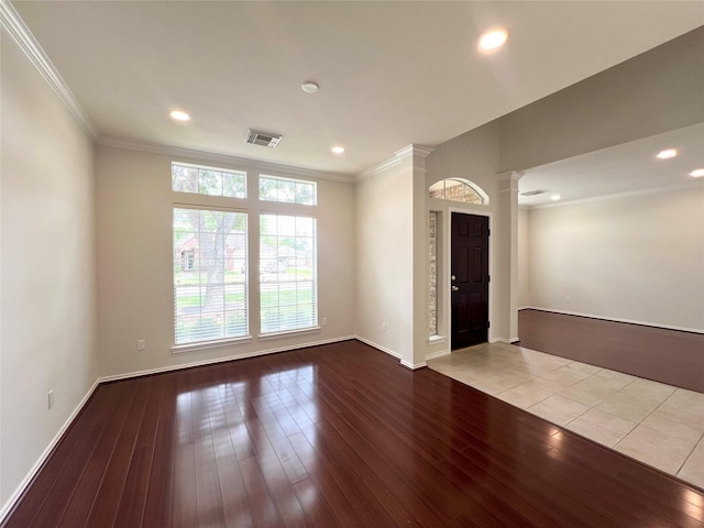 22 Crestview Trl, Houston, TX 77082 - spare room featuring decorative columns, wood-type flooring, ornamental molding, and recessed lighting