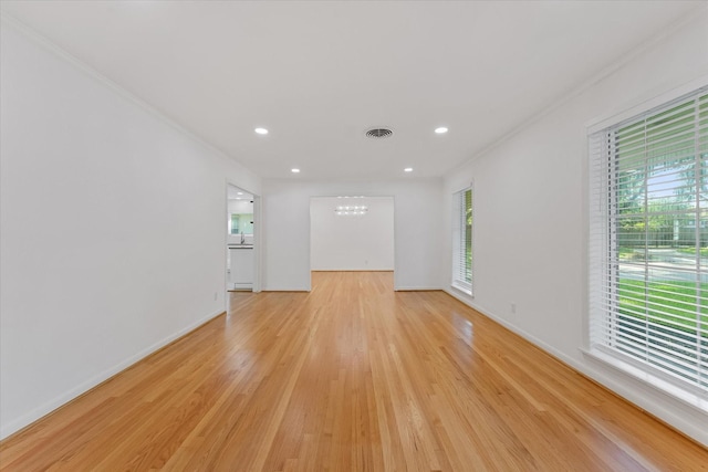 7807 Ella Lee Ln, Houston, TX 77063 - spare room with a chandelier, light wood-type flooring, ornamental molding, and recessed lighting