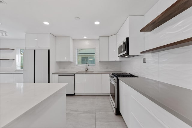 7807 Ella Lee Ln, Houston, TX 77063 - kitchen featuring stainless steel appliances, open shelves, modern cabinets, white cabinets, and recessed lighting