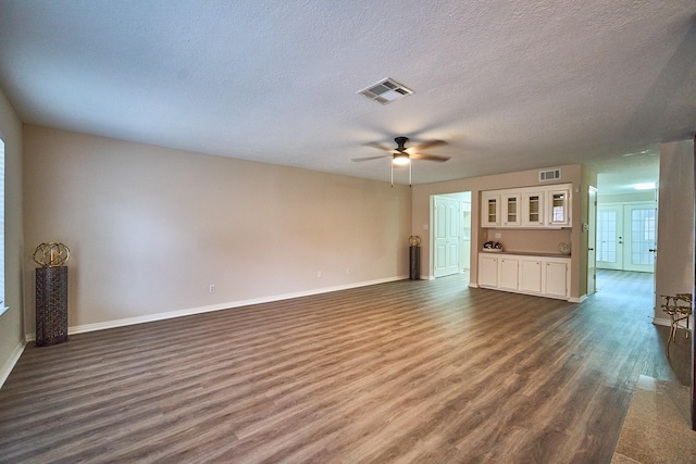 10818 Briar Forest Dr Unit 34, Houston, TX 77042 - unfurnished living room with a ceiling fan, dark wood-type flooring, and a textured ceiling