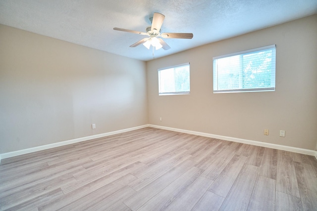 10818 Briar Forest Dr Unit 34, Houston, TX 77042 - empty room with light wood-style flooring and a ceiling fan