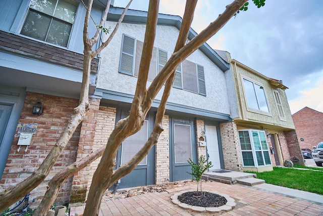10818 Briar Forest Dr Unit 34, Houston, TX 77042 - view of front of home with stucco siding and brick siding