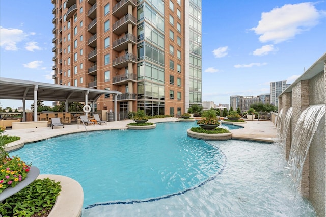 2207 Bancroft St Unit 1104, Houston, TX 77027 - community pool featuring a patio