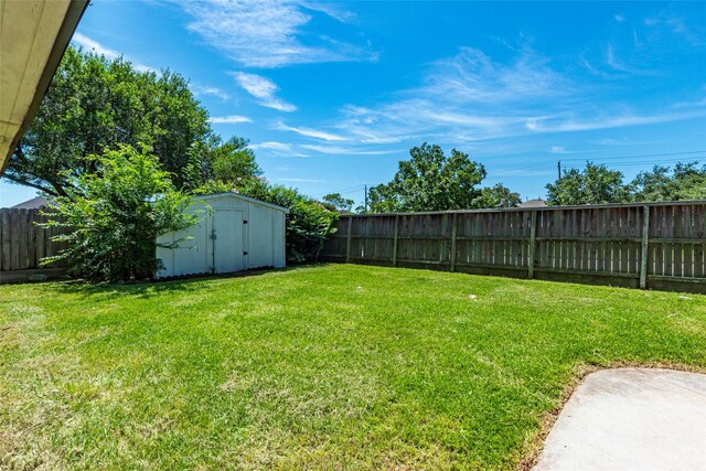 2611 Potomac Dr, League City, TX 77573 - fenced backyard with a storage unit