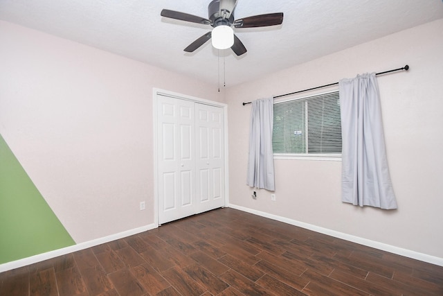 16810 Rockstone, Houston, TX 77084 - unfurnished bedroom with dark wood-style flooring, a closet, and a ceiling fan