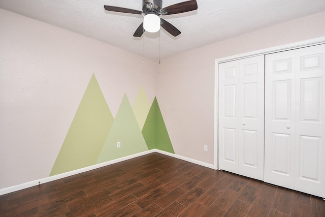16810 Rockstone, Houston, TX 77084 - unfurnished bedroom with dark wood finished floors, a closet, and a ceiling fan
