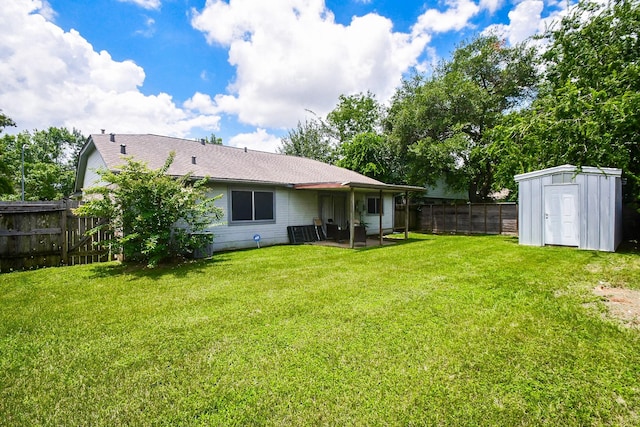 16810 Rockstone, Houston, TX 77084 - back of property with a fenced backyard, a shed, roof with shingles, and a patio area
