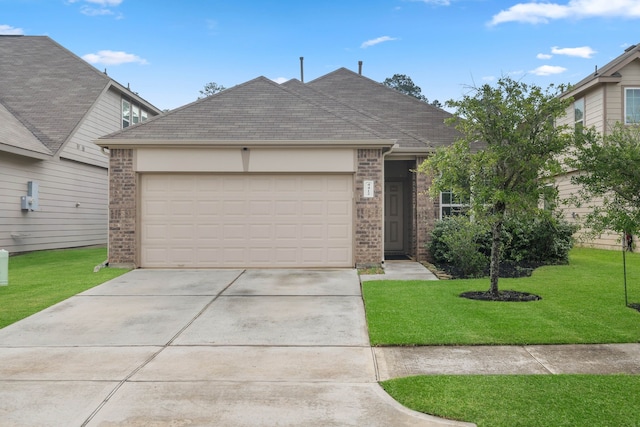 4412 Eveslage Ln, Conroe, TX 77304 - view of front of property with driveway, an attached garage, brick siding, and a front yard
