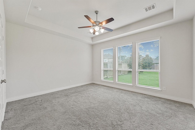 14251 Archer County Trl, Cypress, TX 77429 - carpeted spare room featuring a tray ceiling, a ceiling fan, and a smoke detector