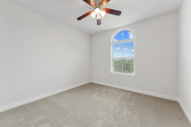 14251 Archer County Trl, Cypress, TX 77429 - carpeted spare room featuring baseboards and a ceiling fan