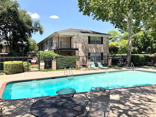 7900 Westheimer Rd Unit 143, Houston, TX 77063 - community pool featuring a patio area