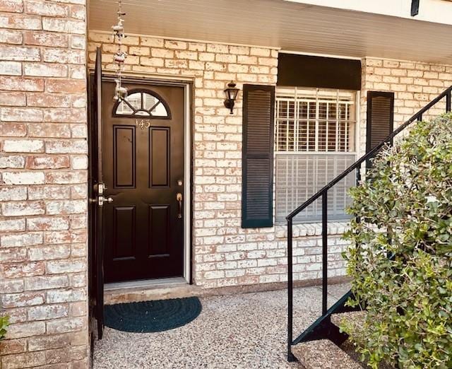 7900 Westheimer Rd Unit 143, Houston, TX 77063 - entrance to property featuring brick siding and covered porch