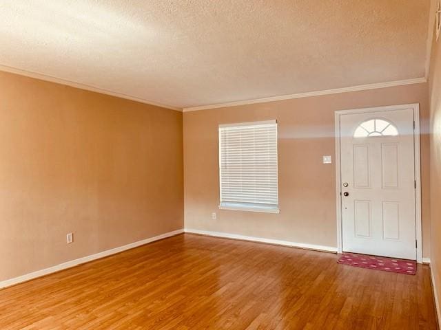 7900 Westheimer Rd Unit 143, Houston, TX 77063 - entryway featuring wood finished floors, a textured ceiling, and ornamental molding