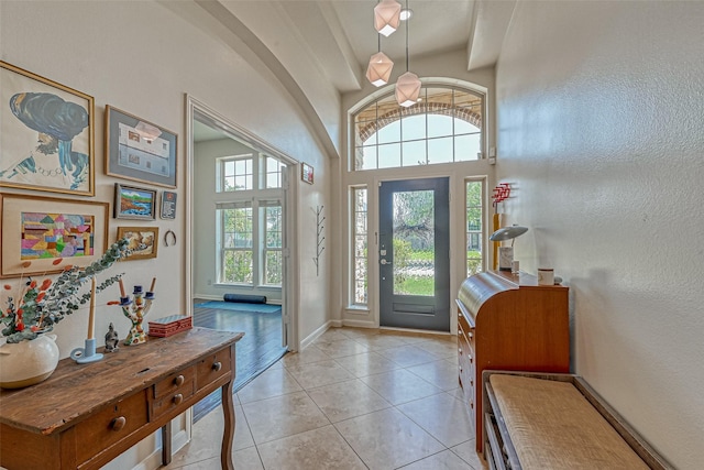5918 Emmit Creek Ln, Sugar Land, TX 77479 - foyer entrance featuring light tile patterned floors and a textured wall