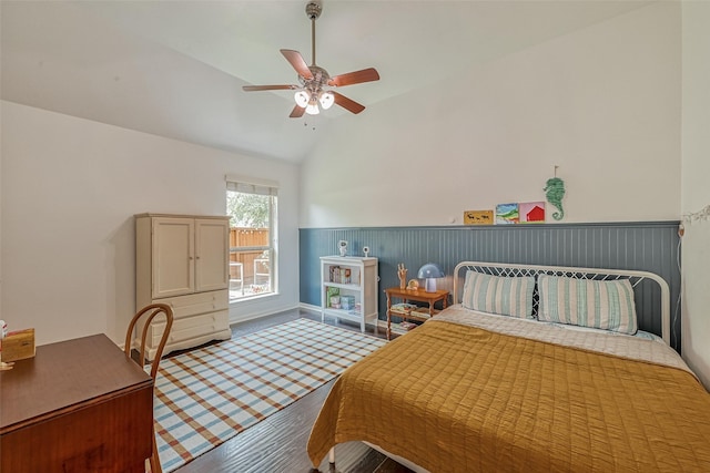 5918 Emmit Creek Ln, Sugar Land, TX 77479 - bedroom featuring a wainscoted wall, wood finished floors, lofted ceiling, and ceiling fan