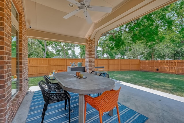5918 Emmit Creek Ln, Sugar Land, TX 77479 - fenced backyard featuring a ceiling fan, a patio, and outdoor dining area