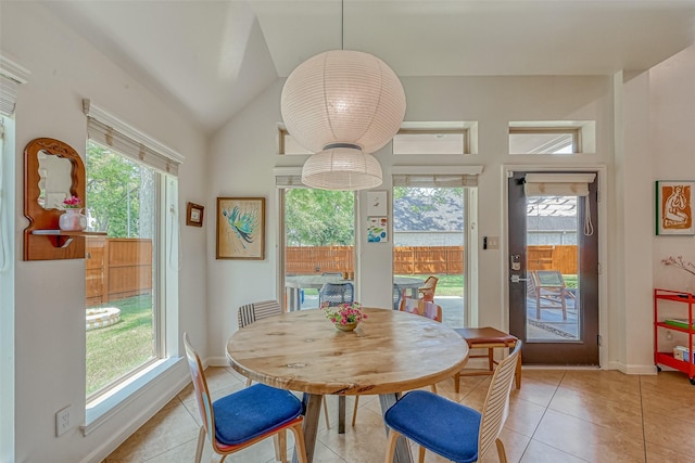 5918 Emmit Creek Ln, Sugar Land, TX 77479 - dining room featuring light tile patterned floors and lofted ceiling