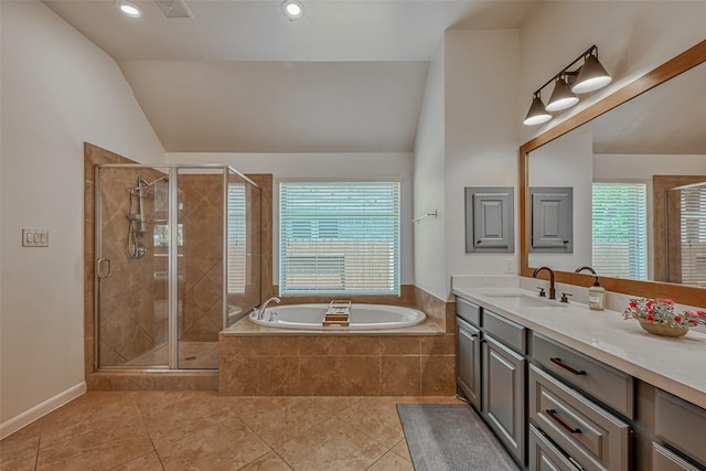5918 Emmit Creek Ln, Sugar Land, TX 77479 - bathroom featuring vanity, a bath, lofted ceiling, a stall shower, and tile patterned floors