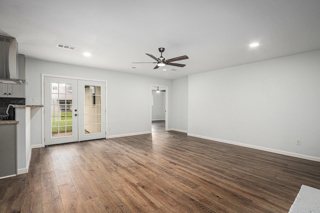 8419 Sterlingshire St, Houston, TX 77078 - unfurnished living room featuring french doors, dark wood finished floors, ceiling fan, and recessed lighting