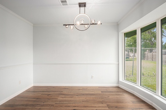 8419 Sterlingshire St, Houston, TX 77078 - unfurnished room with a chandelier, plenty of natural light, crown molding, and wood finished floors