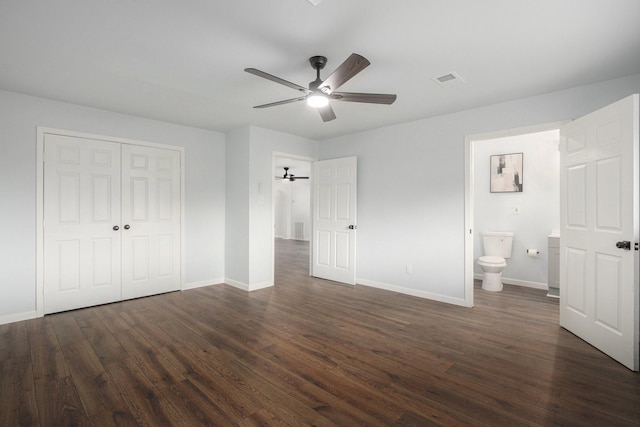 8419 Sterlingshire St, Houston, TX 77078 - unfurnished bedroom featuring dark wood-type flooring, a closet, connected bathroom, and ceiling fan