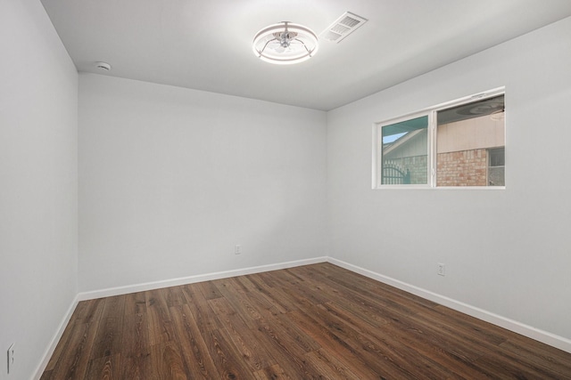 8419 Sterlingshire St, Houston, TX 77078 - empty room with dark wood-style floors and a smoke detector