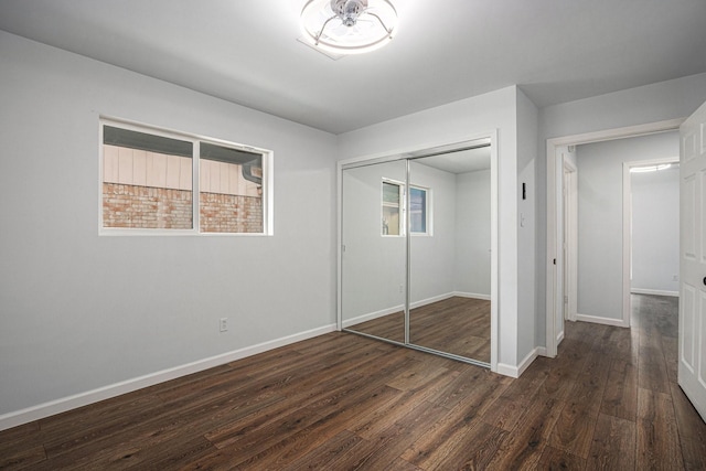8419 Sterlingshire St, Houston, TX 77078 - unfurnished bedroom featuring dark wood-style flooring and a closet
