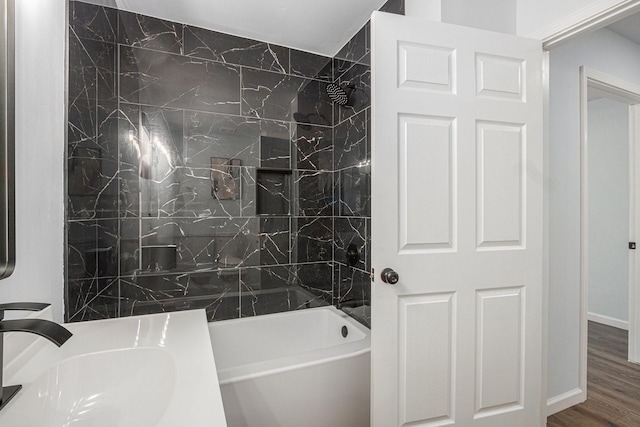 8419 Sterlingshire St, Houston, TX 77078 - full bathroom with wood finished floors, shower / bath combination, and vanity