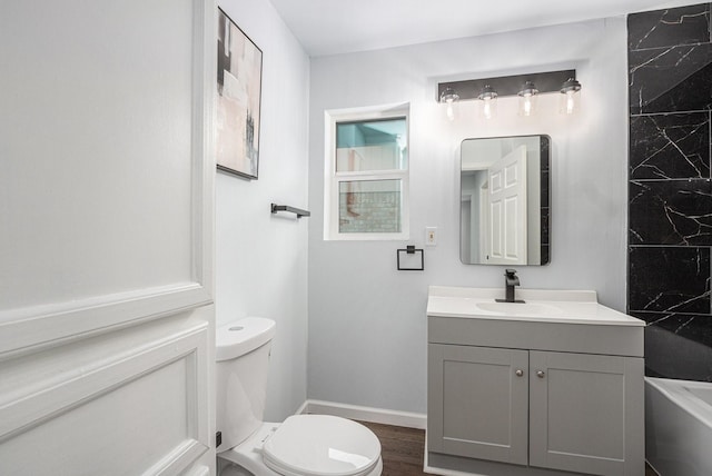 8419 Sterlingshire St, Houston, TX 77078 - full bathroom with vanity, a tub to relax in, and wood finished floors