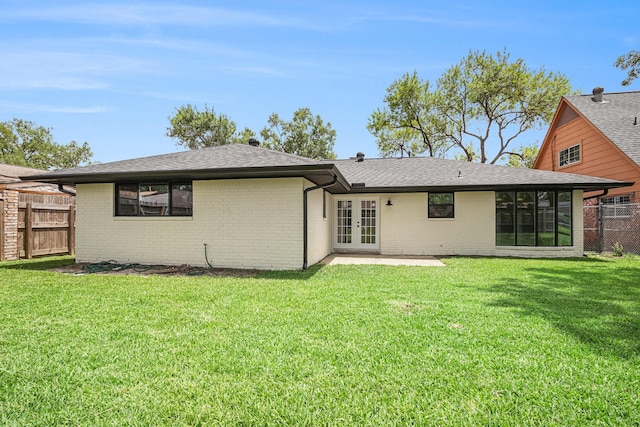 8419 Sterlingshire St, Houston, TX 77078 - rear view of house with french doors, a patio area, and brick siding
