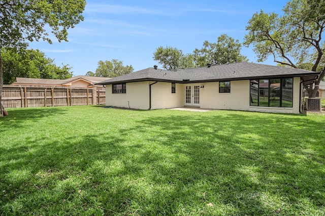 8419 Sterlingshire St, Houston, TX 77078 - back of property featuring french doors, brick siding, a shingled roof, and a patio