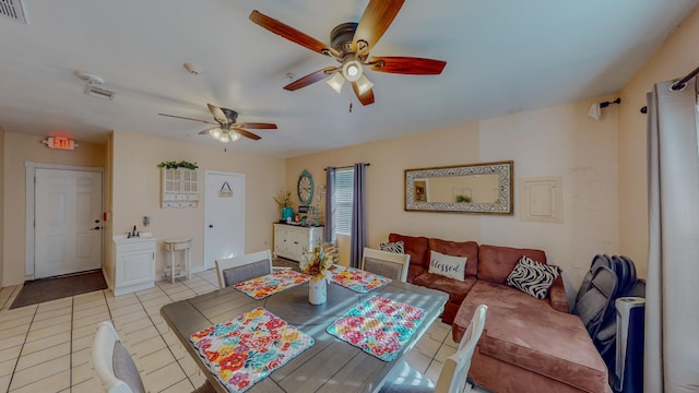 216 E Plantation Dr, Clute, TX 77531 - dining area featuring ceiling fan and light tile patterned floors