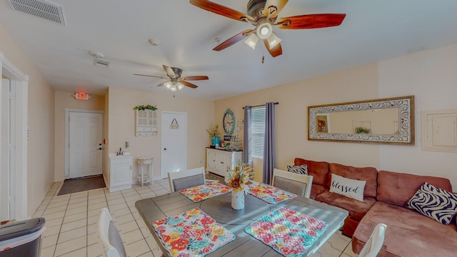 216 E Plantation Dr, Clute, TX 77531 - dining space featuring a ceiling fan and light tile patterned flooring