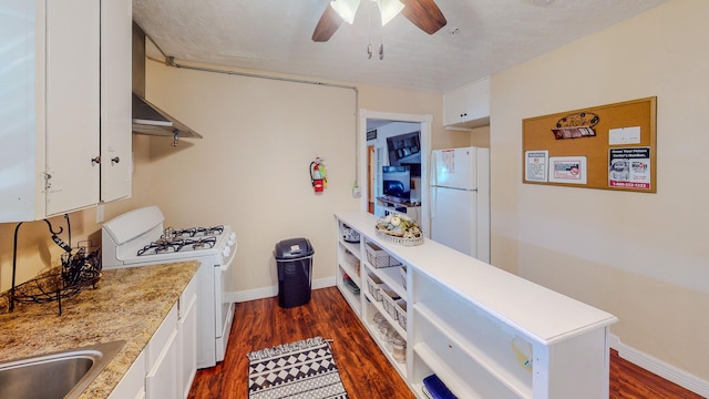 216 E Plantation Dr, Clute, TX 77531 - kitchen featuring white appliances, light countertops, a ceiling fan, and white cabinets
