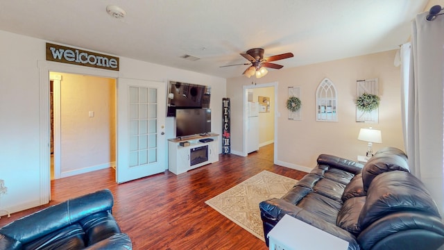 216 E Plantation Dr, Clute, TX 77531 - living area featuring ceiling fan and dark wood-style floors