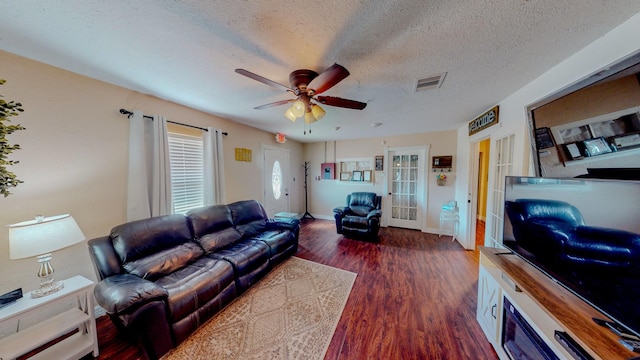216 E Plantation Dr, Clute, TX 77531 - living room featuring ceiling fan, wood finished floors, french doors, and a textured ceiling