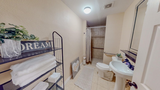 216 E Plantation Dr, Clute, TX 77531 - full bathroom featuring tile patterned floors and curtained shower
