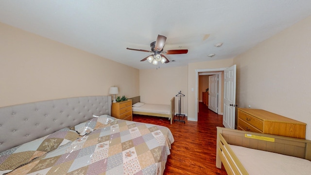 216 E Plantation Dr, Clute, TX 77531 - bedroom with dark wood-style floors and ceiling fan