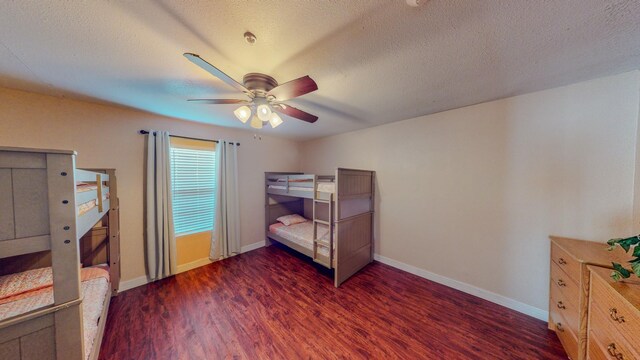 216 E Plantation Dr, Clute, TX 77531 - bedroom with wood finished floors, a textured ceiling, and a ceiling fan