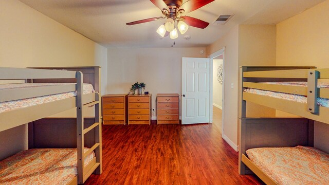 216 E Plantation Dr, Clute, TX 77531 - bedroom featuring wood finished floors and a ceiling fan