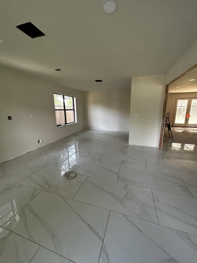 12206 Fairhaven Ln, Montgomery, TX 77356 - unfurnished room featuring healthy amount of natural light and marble look tiles