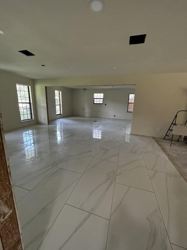 12206 Fairhaven Ln, Montgomery, TX 77356 - unfurnished room with healthy amount of natural light and light marble finish floors