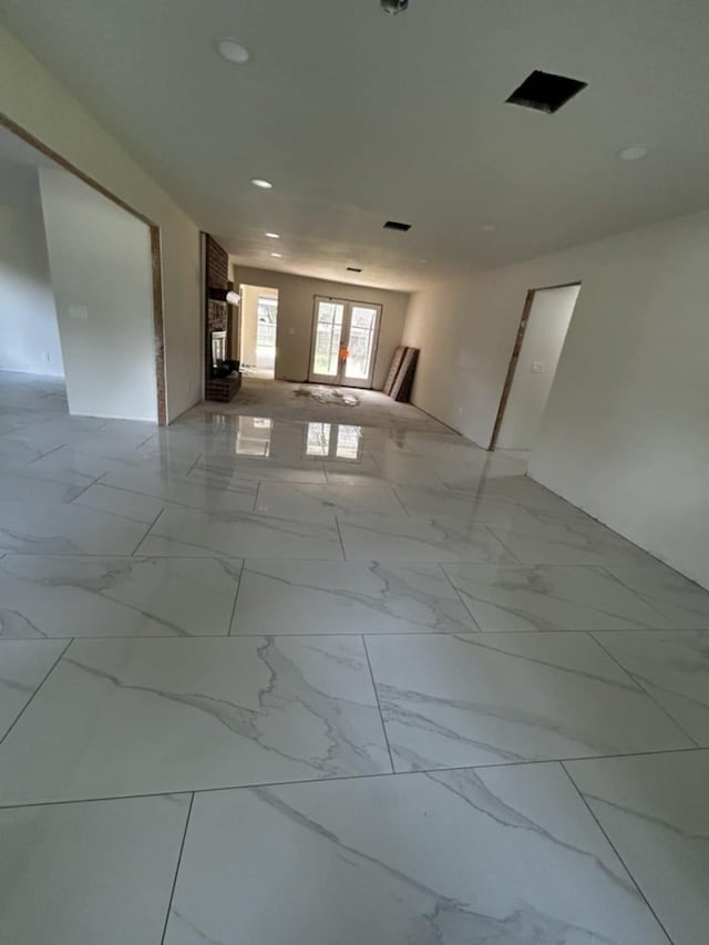 12206 Fairhaven Ln, Montgomery, TX 77356 - unfurnished room with light marble finish floors and recessed lighting
