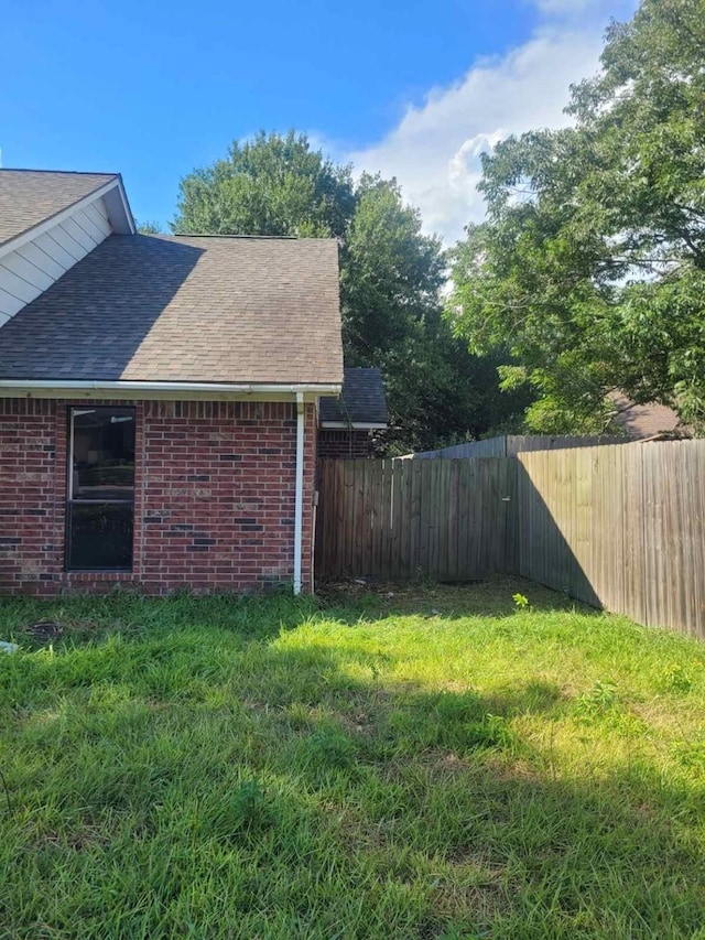 12206 Fairhaven Ln, Montgomery, TX 77356 - view of home's exterior with a shingled roof and brick siding