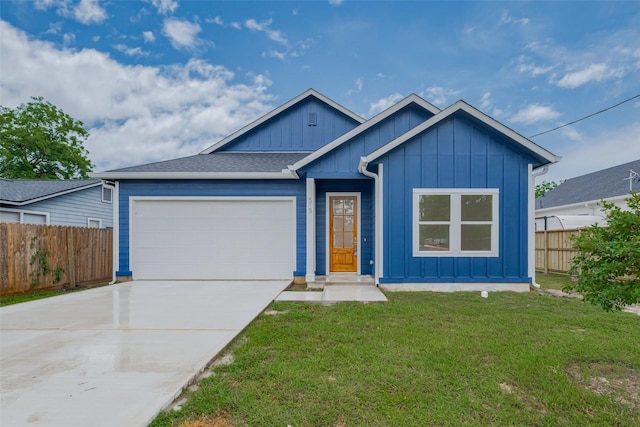 515 Briarcliff Dr, Houston, TX 77076 - view of front facade with board and batten siding, an attached garage, and concrete driveway