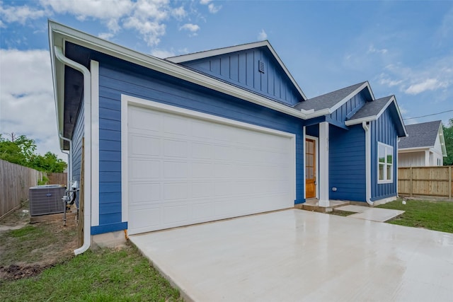 515 Briarcliff Dr, Houston, TX 77076 - view of front facade featuring board and batten siding, driveway, and an attached garage