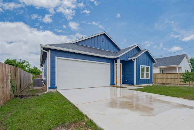 515 Briarcliff Dr, Houston, TX 77076 - view of front of house with board and batten siding, a garage, concrete driveway, and roof with shingles