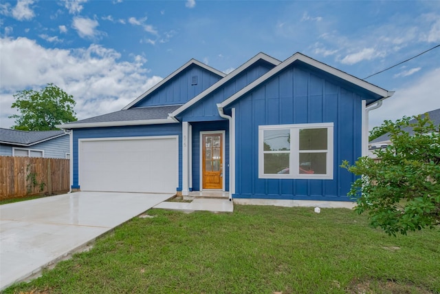 515 Briarcliff Dr, Houston, TX 77076 - ranch-style house with board and batten siding, an attached garage, and driveway