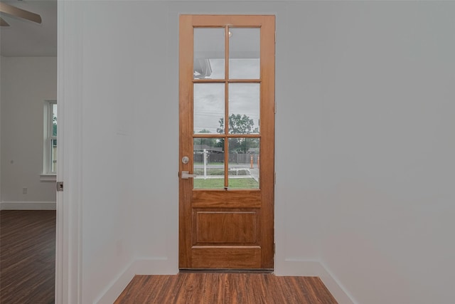 515 Briarcliff Dr, Houston, TX 77076 - doorway to outside featuring dark wood finished floors and baseboards